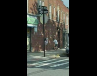 Woman with a bouquet of flower in front of brick wall