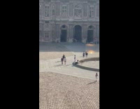Man photographer lie down on the public park