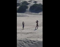 Guy black brief flex biceps muscles beach