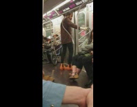 Man wears brown snakeskin shirt and orange boots on the subway #BluePointWhatTheL