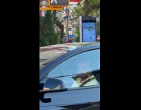 Guy wears devil costume dance on sidewalk