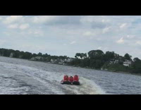 Raft attached to boat flips over in water after turning, My heart will go on song