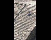 girl white shirt pyramid steps