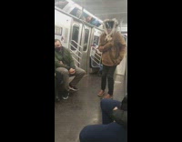 Guy large dreamcatcher on head dances subway 