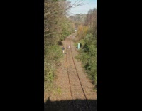 Woman violet leggings stand rock railway pictorial
