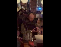 Collab Subway Creatures - Man wearing suitcase as costume for Halloween