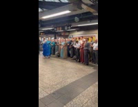 Choir people sing and harmonize at subway