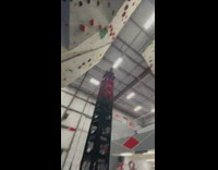 Rock climber stacks crates 