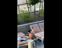 Collab IITW - Man shirtless eats by the pool in front of the camera