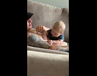 Baby finds and bite nipple of father