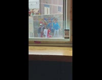 Group guys blue shirt sing horn beach