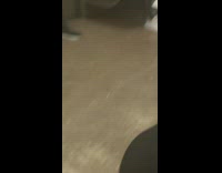 Woman wearing weird head coverings riding the subway