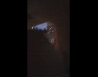 Man greet batman on batmobile stoplight night