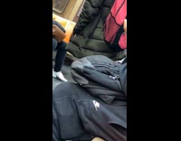 Man in train with white face paint