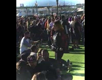 Woman in sexy racer outfit poses at the concert