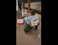 Woman uses her feet to make drawing of drake