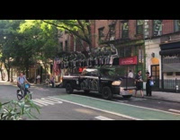 Truck has statue on it on street