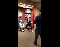 man flex with r2d2 statue disneyland