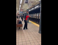 Man do yoyo tricks in subway station