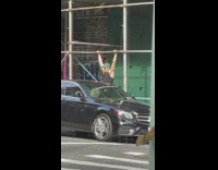 Guy does ab exercise with sidewalk bars 