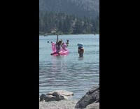Girl bikini beer pink unicorn floater beach