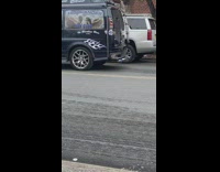 Old blue van decorated with pictures of famous artists