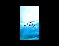 Six jets fly above filmer at beach