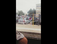 Woman printed pants sit grey car caught