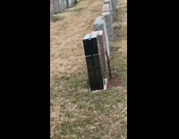 Black PS5 headstone at cemetary