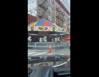 Car drive by street with a carnival
