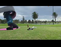 Wind hits girl with pink yoga mat 