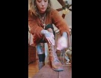 Girl speed laces her brown boots