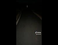 Shirtless man run fast on dark road