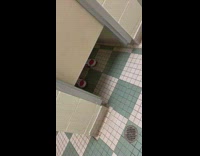 Guy reaches under bathroom stall mascot grabs his arm