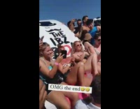 Guy takes off his beach shorts to reveal thong 