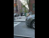 Man navy gray jacket with macbook dance sidewalk
