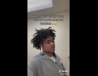 Guy tries not to laugh at her joke 