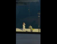 Woman white pants pose at boat docks