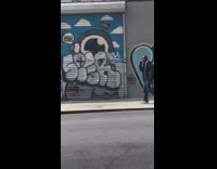 Man in black cusses and yells over the phone 