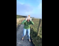 Friends struggles with strong wind in ireland