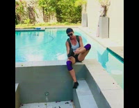 Girl falls backwards into pool weighted backpack 