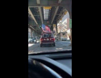 Car with Donald Trump Never Surrender flag