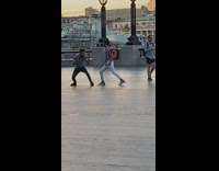 Two guys film tiktok white pants sunset 