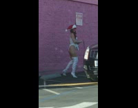 Woman white undergarments lean pink wall leash