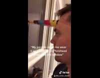 Parents make guy wear party hat window 