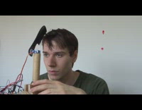Guy builds robot to comb his hair 