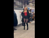 Woman tiktok dance between cops at subway