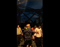 People dance at flash rave on street