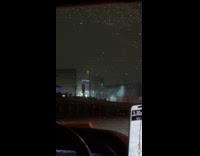 Fireworks display from house near the highway