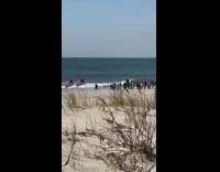 Man preaches in ocean water